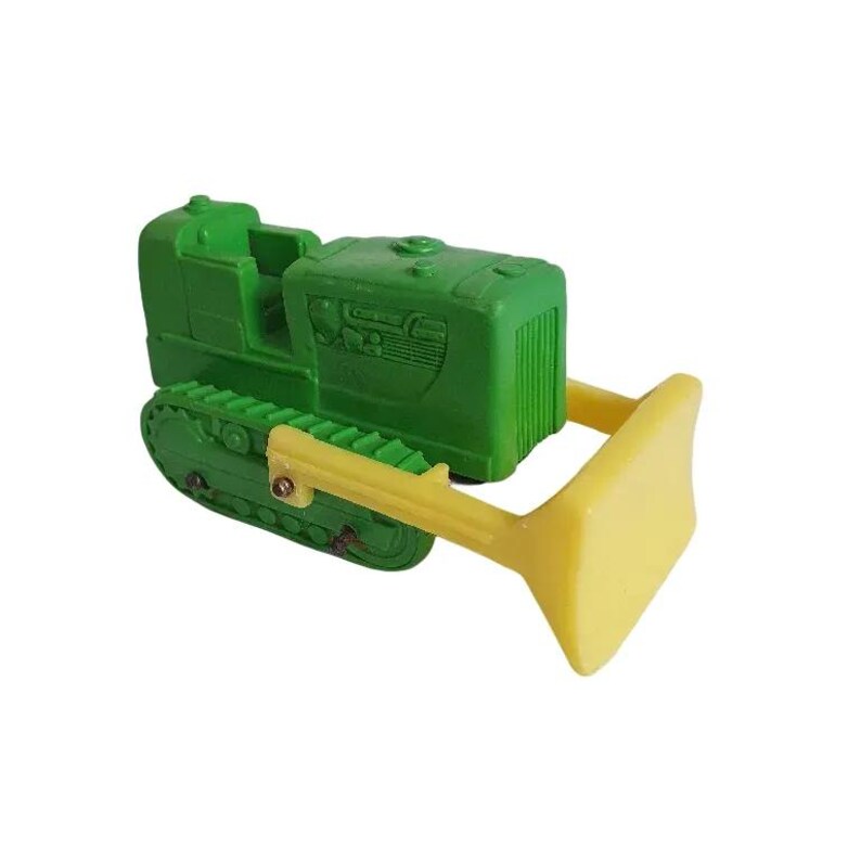 May include: A green toy bulldozer with a yellow blade. The bulldozer has a detailed cab and tracks.