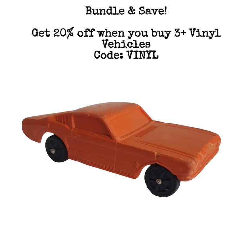 Puede incluir: Coche de juguete de vinilo naranja con ruedas negras. El coche es de estilo cl&aacute;sico muscle car. El texto en la imagen dice "Bundle & Save! Get 20% off when you buy 3+ Vinyl Vehicles Code: VINYL."