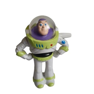 May include: A Buzz Lightyear action figure from the Toy Story franchise. The figure is primarily white with green, purple, and black accents. It features a clear helmet, a smiling face, and the number "000" on the chest.