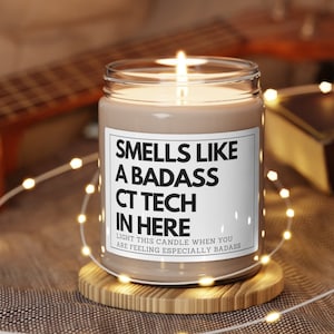 May include: A brown candle with a white label that reads "Smells like a badass CT Tech in here. Light this candle when you are feeling especially badass."