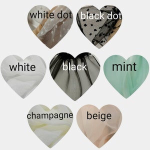 Puede incluir: Surtido de muestras de tela de tul en forma de coraz&oacute;n. Los colores incluyen blanco, negro, menta, champ&aacute;n, beige, blanco con lunares y negro con lunares.