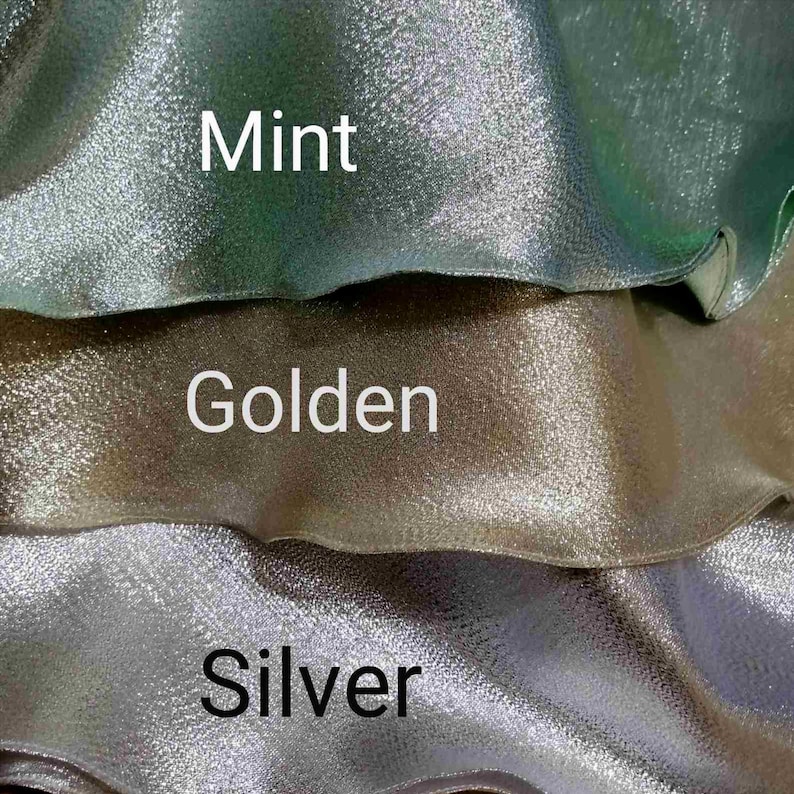 May include: Three swatches of fabric in different colors: mint, golden, and silver. The fabric has a shimmery, iridescent finish.