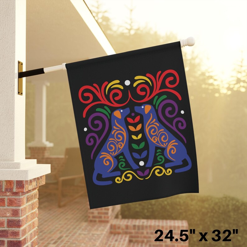 May include: A black garden flag with two blue dogs facing each other. The dogs are outlined in rainbow colors and surrounded by colorful swirls. The flag measures 24.5 inches by 32 inches.