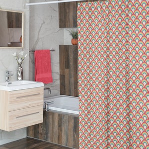 May include: A shower curtain with a repeating pattern of rainbow arches on a cream background. The arches are in shades of pink, orange, yellow, green, blue, and purple.