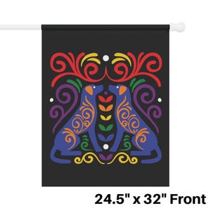 May include: A black flag with a rainbow-colored design featuring two blue dogs facing each other. The dogs are surrounded by intricate swirls and floral patterns. The flag measures 24.5 inches by 32 inches.