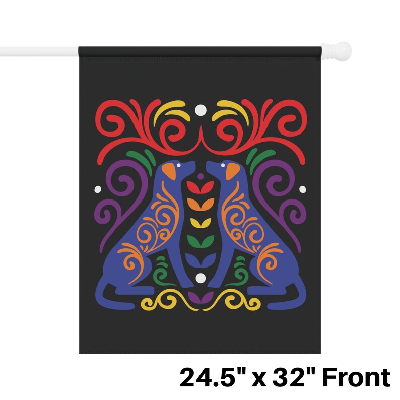 May include: A black flag with a rainbow-colored design featuring two blue dogs facing each other. The dogs are surrounded by intricate swirls and floral patterns. The flag measures 24.5 inches by 32 inches.