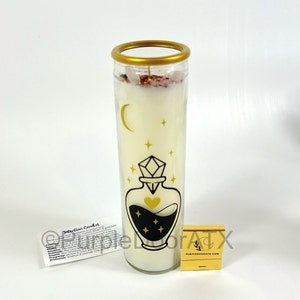 A set of eight glass candles with mystical designs on front and crystals on top.