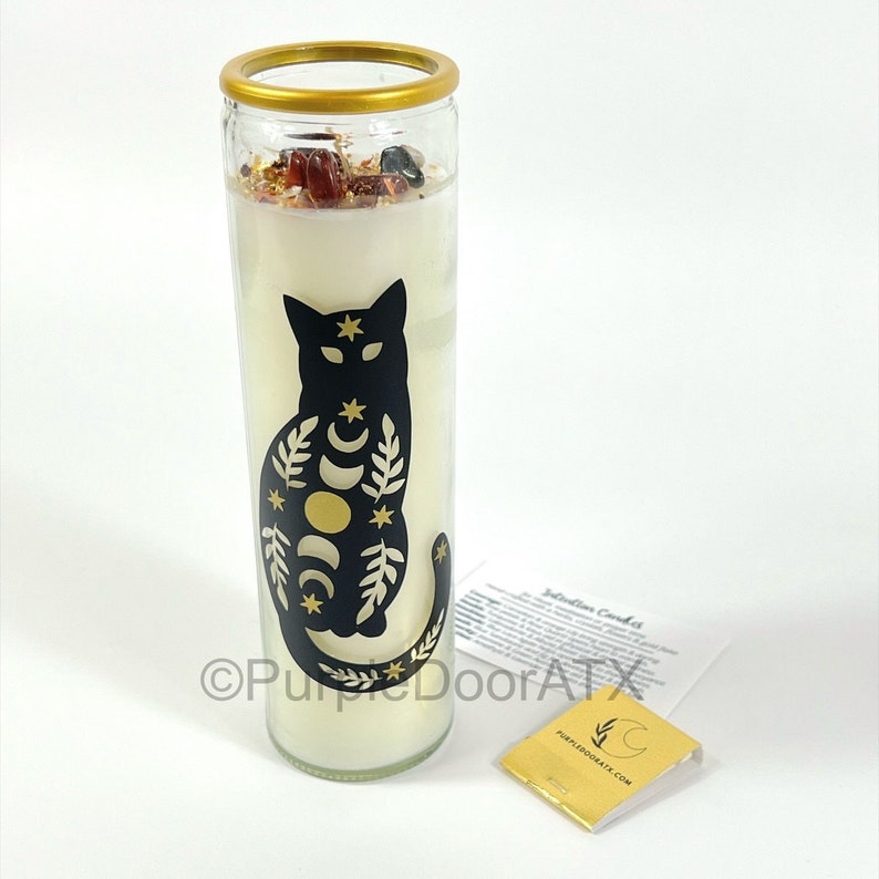 A set of eight glass candles with mystical designs on front and crystals on top.