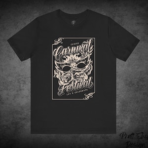 May include: Black t-shirt with a white graphic design featuring a Venetian Carnival mask with flowers and the text "Venice Carnival Festival Let's Celebrate".