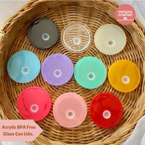 May include: Assortment of 10 colorful acrylic lids for glass jars. The lids are BPA free and come in a variety of colors, including black, white, blue, purple, green, yellow, pink, and red.  The lids are perfect for storing food, drinks, or crafts.