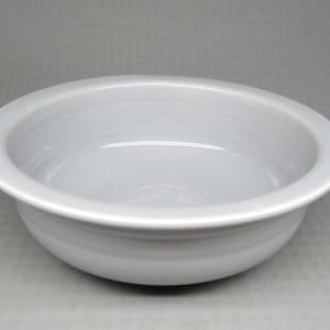 May include: A light gray ceramic bowl with a rounded rim and a smooth, glazed finish.