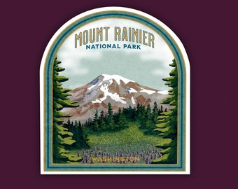 May include: A vintage-style sticker featuring a scenic view of Mount Rainier National Park in Washington state. The sticker has a blue and green color scheme with a white border and text that reads "Mount Rainier National Park, Washington".