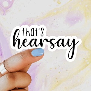 May include: A white sticker with black text that reads "that's hearsay".