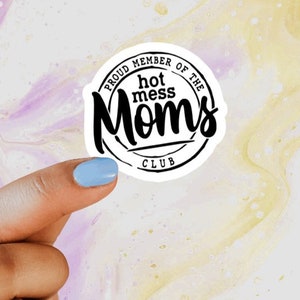 May include: White sticker with black text that reads "Proud Member of the Hot Mess Moms Club".