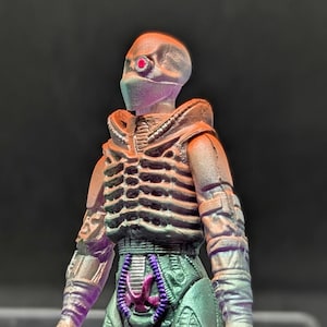 Shadow Minister (airbrushed) by Tiddy Bean Toys X Terrible Toyworks. 1 of 1. Hand cast and painted, UV reactive. 3 points of articulation.