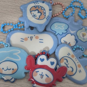 seafoam poofy charms