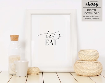 May include: White framed printable wall art with the text "let's eat" in black calligraphy font.