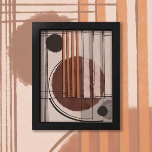 May include: A black framed print with an abstract design featuring brown, orange, and gray circles and lines on a white background.