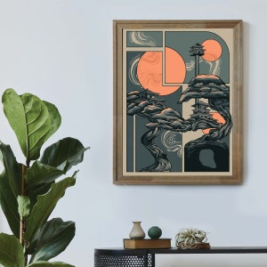 May include: A framed illustration of a stylized tree with two small buildings on top. The tree is in shades of green and brown, and the background is a light beige with two orange circles. The illustration is framed in a light brown wood frame.