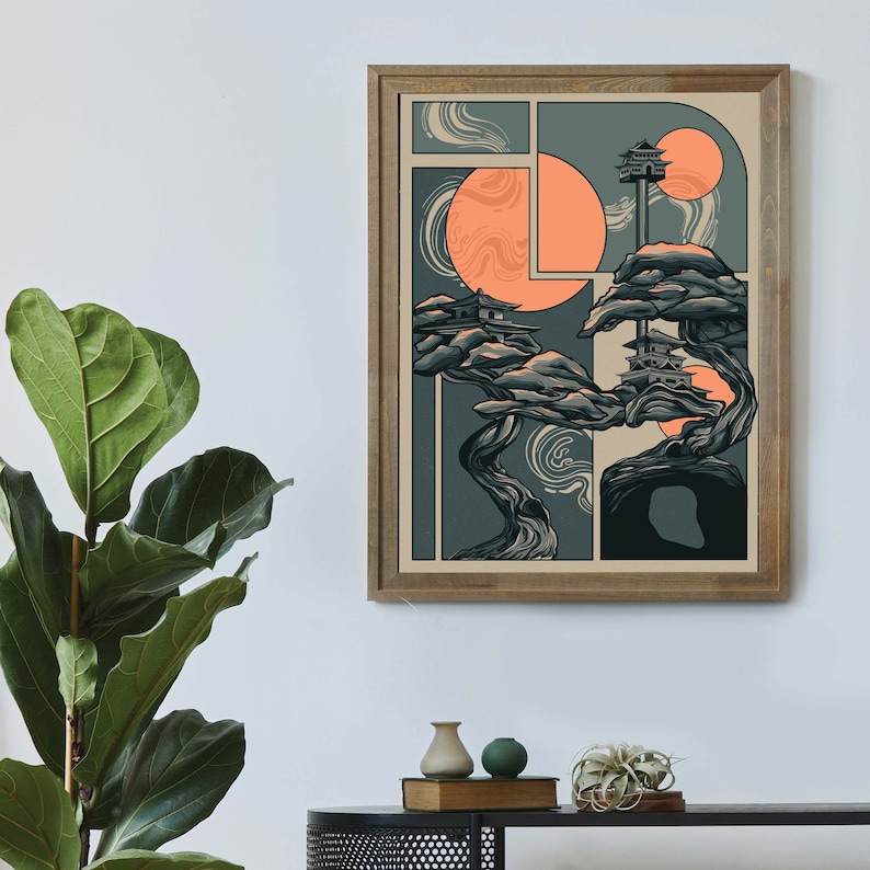 May include: A framed illustration of a stylized tree with two small buildings on top. The tree is in shades of green and brown, and the background is a light beige with two orange circles. The illustration is framed in a light brown wood frame.