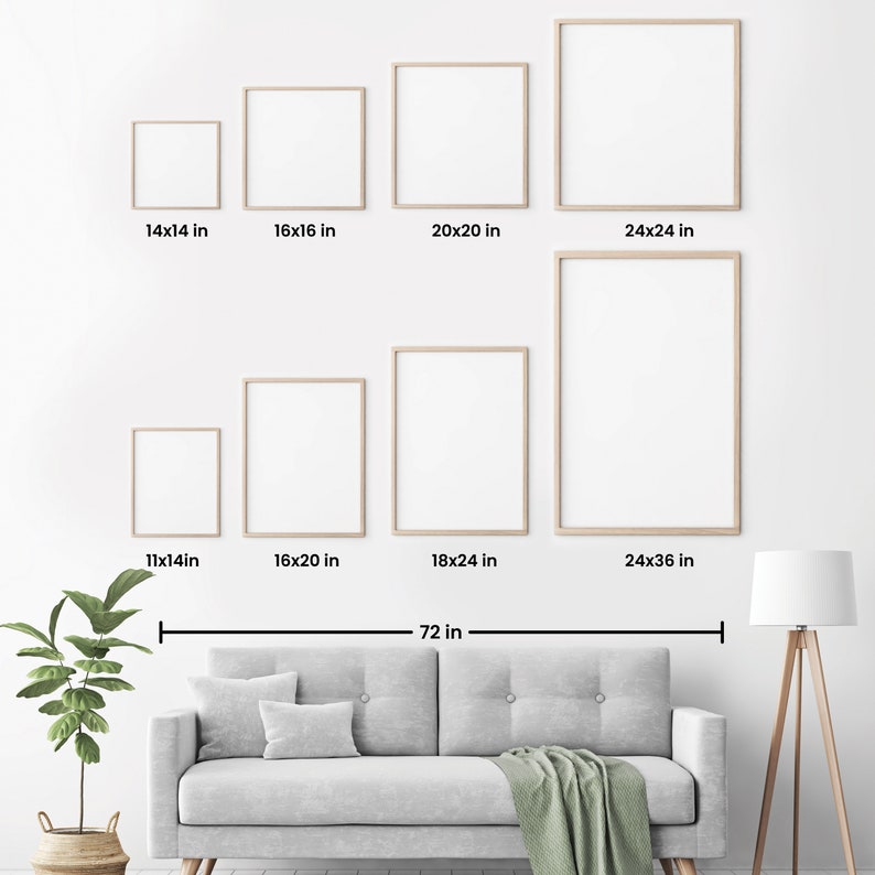 May include: A white wall with eight different sized picture frames, ranging from 11x14 inches to 24x36 inches. The frames are arranged in two rows, with the larger frames at the bottom. A gray couch with a green throw blanket is in front of the wall. A potted plant and a floor lamp are on either side of the couch.