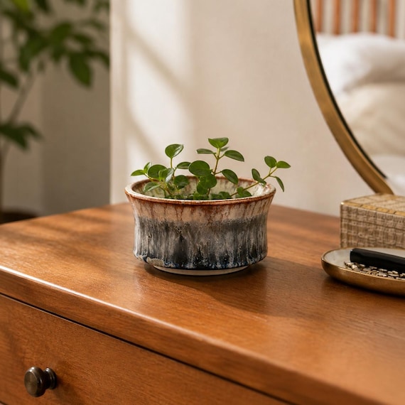 One-of-a-kind blue-gray wheel-thrown pottery that doubles as a ring dish, succulent planter, or desk catch-all — truly made by a human, not a machine.