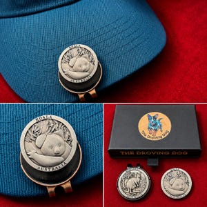 May include: A circular metal hat clip featuring a relief of a koala in eucalyptus leaves with the text KOALA AUSTRALIA. The set includes a black box labeled THE DROVING DOG and two clips, one depicting a kangaroo and one depicting a koala.