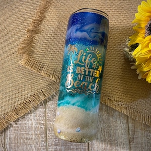 Life Is Better At The Beach Themed Tumbler (#1), made with custom glitter and vinyl, wine/modern/skinny tumbler with lid & straw