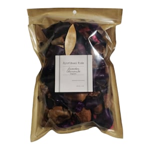 May include: A clear plastic bag filled with dried lavender and chamomile potpourri. The bag has a brown paper backing and a white label that reads "Spiritual Kids Lavender Chamomile". A wooden piece is included.