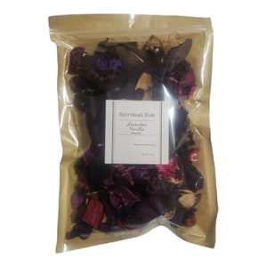 May include: A clear plastic bag filled with dried potpourri. The potpourri is a mix of dark purple, red, and tan pieces. A white label with the text "Spiritual Kids Lavender Vanilla" is affixed to the bag.