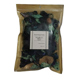 May include: A clear plastic bag filled with dried botanicals. The bag has a brown paper top and a white label with the text "Spiritual Kids Moonflower Nectar". The botanicals are a mix of blue, green, and brown.