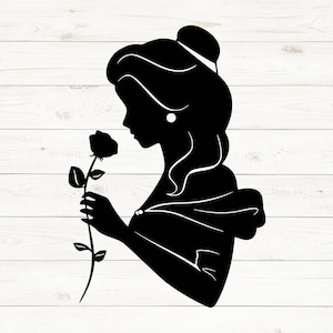 May include: Black silhouette of a woman holding a rose. The woman is wearing a dress and has her hair up in a bun. The rose has a long stem and is in full bloom. The image is set against a white wood background.