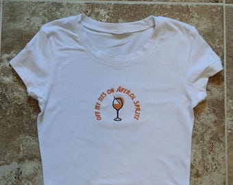 Off My T*ts on Aperol Spritz Embroidered womens baby tee