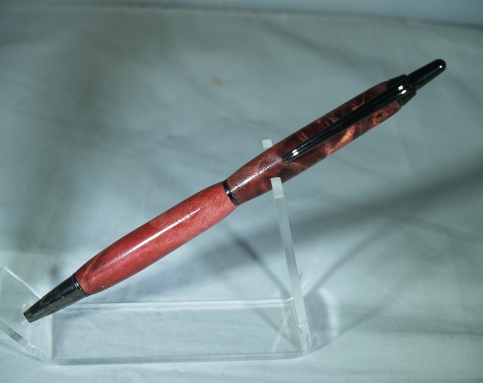 Gun metal click pen dressed in dyed and stabilized Buckeye Burl