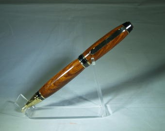 Gold trim cigar pen dressed in Desert ironwood