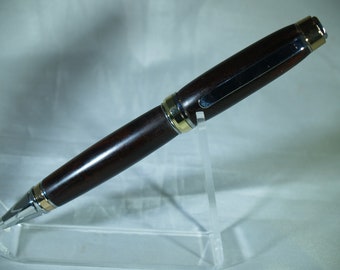 gold and chrome cigar pen in desert ironwood