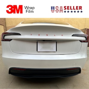 May include: Rear view of a white Tesla car with red lettering spelling out "TESLA". The image includes the text "3M Wrap Film" and a "USA SELLER" graphic.
