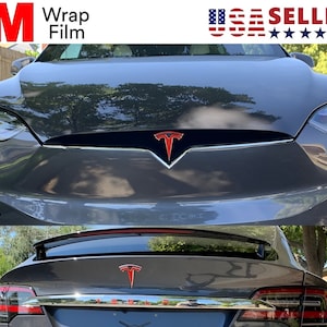 May include: A gray Tesla car with a red Tesla logo on the front and back. The front of the car has the text "3M Wrap Film" in red and white. The image also includes the text "USA SELLER" with the American flag.