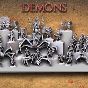 May include: A collection of grey, plastic miniature demon figures, including a large demon with spider legs, and smaller demon figures with swords and other weapons. The figures are arranged on a white shelf with a brown background. The text "DEMONS" is printed in black at the top of the image.