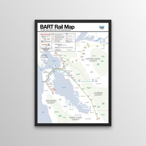 May include: A framed BART Rail Map poster. The map displays the Bay Area Rapid Transit system with colored lines representing different routes. Counties are labeled, and the map includes a key for rapid transit guides.