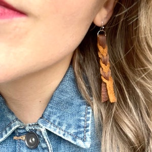 Slit braid genuine leather tassel earrings