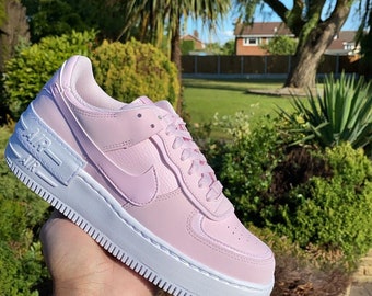 white af1 with pink swoosh