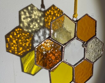 Stained glass honeycomb suncatcher with Tibetan Bee charm