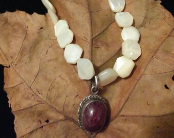 Red ruby silver pendant with white smooth pearl like beads