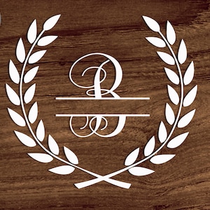 May include: White monogram initial "B" with a split design and a laurel wreath around it. The design is on a brown wood background.