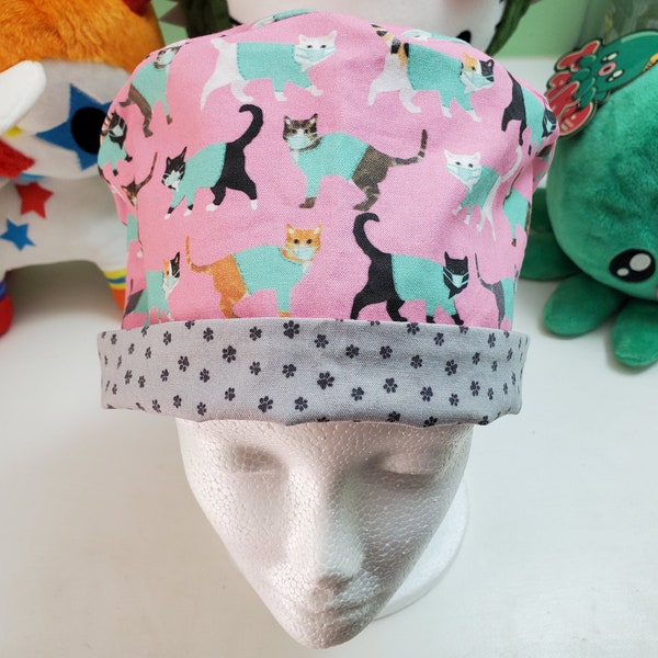 Cats wearing scrubs and masks with coordinating paw print fabric pixie style hat