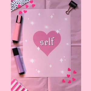 May include: Pink and white print with a pink heart and the word "self" in a gothic font. The background is covered in white stars.