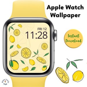 May include: A yellow Apple Watch with a lemon-themed watch face. The watch face displays the time as 11:28 and the day as FRI 12. The background of the watch face is a light yellow with a pattern of lemons and leaves.
