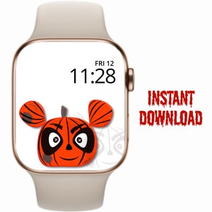 Op de afbeelding: Een digitaal horloge-scherm met een pompoen-achtig personage met een ondeugende grijns. De tijd op het scherm is 11:28 en de dag is vrijdag de 12e. De tekst "INSTANT DOWNLOAD" staat in rode, druppelende letters.