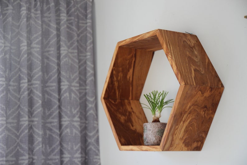 Hexagon wall shelf made of olive wood image 1